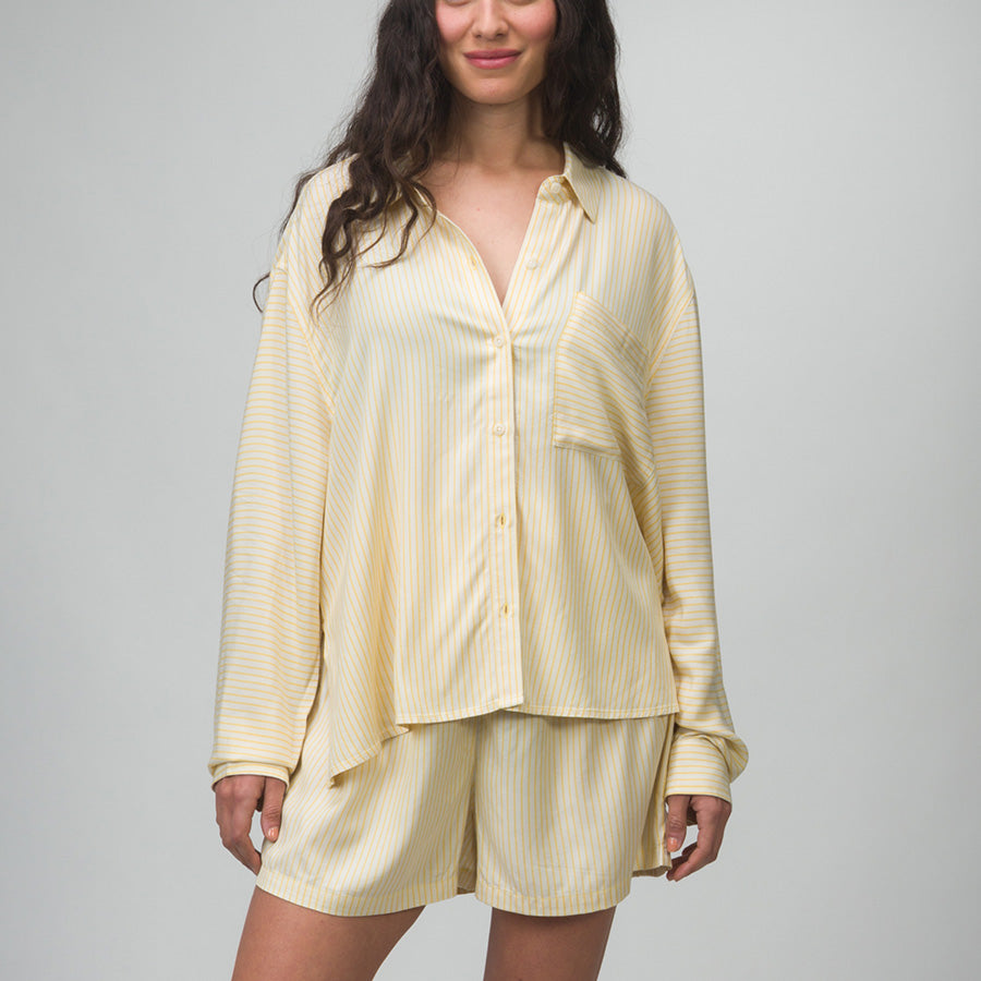 Woman wearing Ellie Button Up light yellow striped shirt facing forward showing front view, comfort-focused casual apparel.