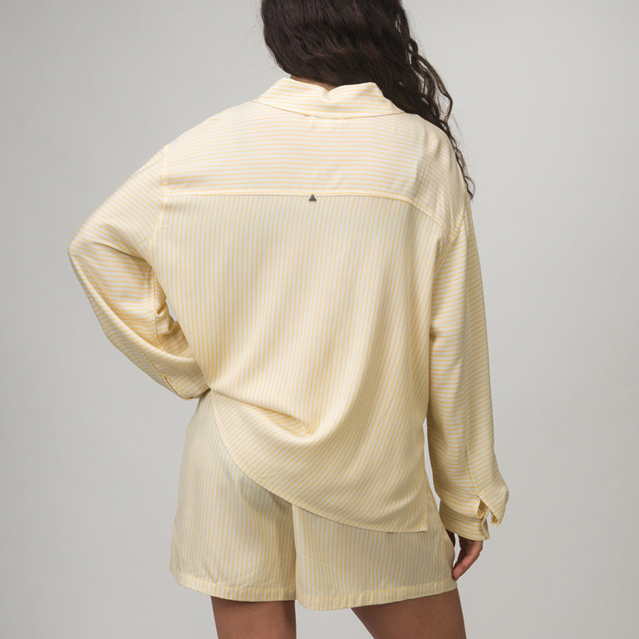 Rear view of Ellie Button Up in soft yellow stripes, showing relaxed fit and beach-inspired comfort for women adults.