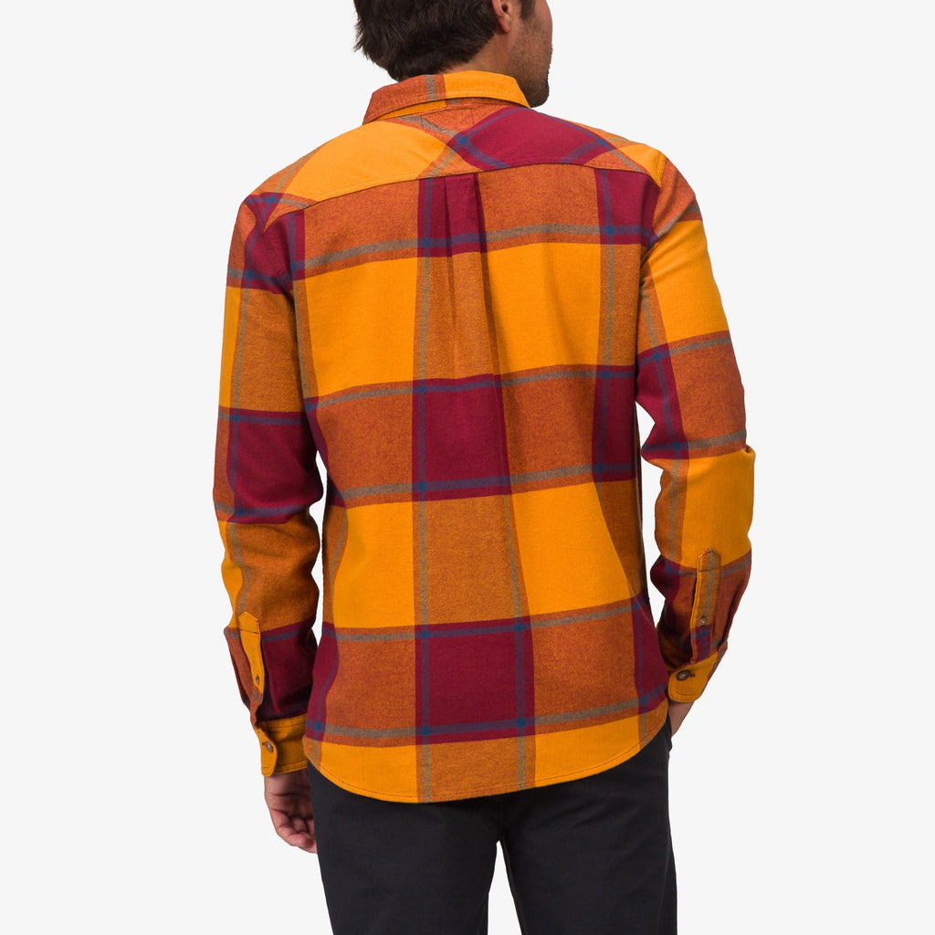 Rear view of a man wearing the Morris Ls Wvn Shirt in orange and red plaid, showcasing comfort-focused, beach-inspired apparel.
