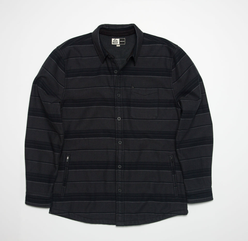 Front view of the Bartlett Woven Jacket in black with subtle stripes, featuring a button-up design and collar.