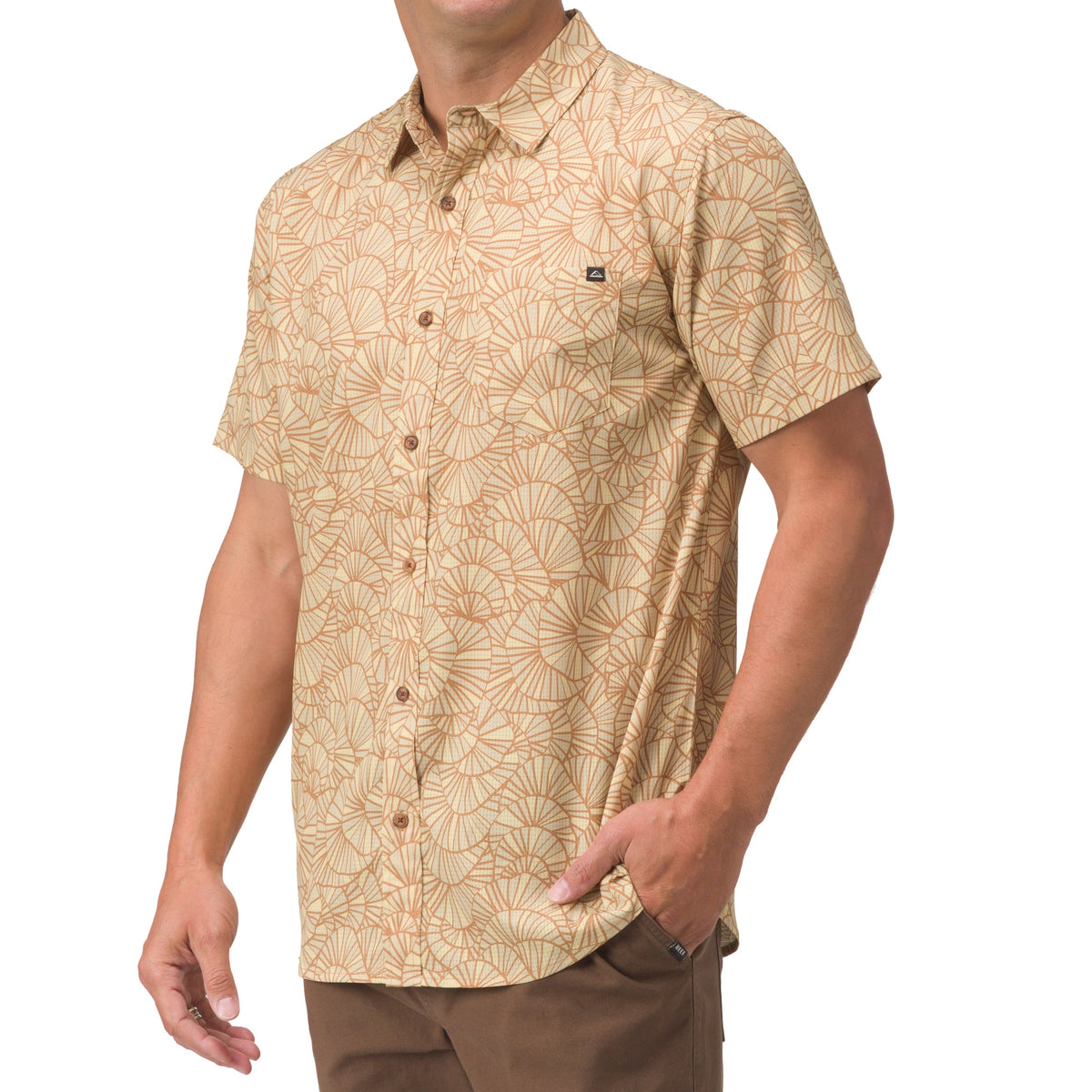 Man wearing a front view of the Hartman Woven Shirt with beige and orange surf-inspired pattern, short sleeves, and button front.
