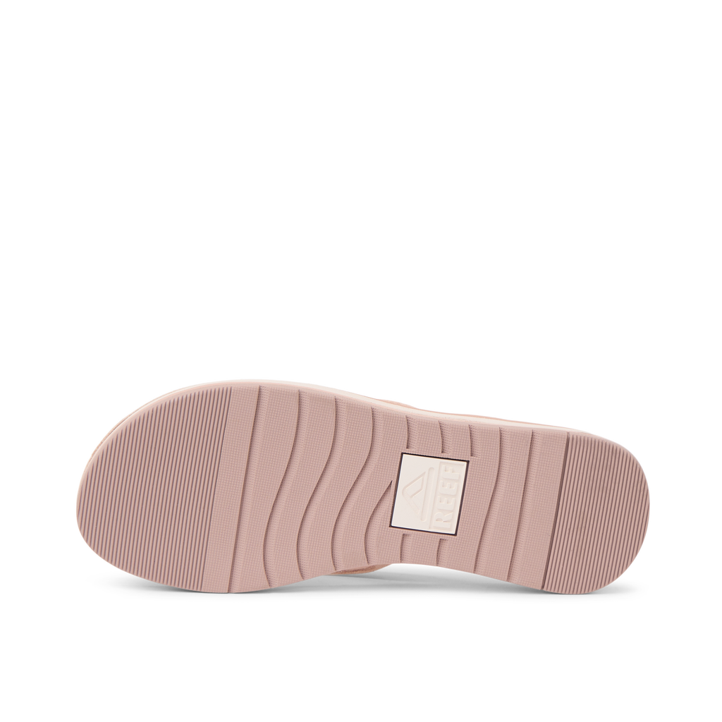 Ojai Classic Slim shoe sole facing up, showing durable textured outsole with anatomical arch support in blush suede color.