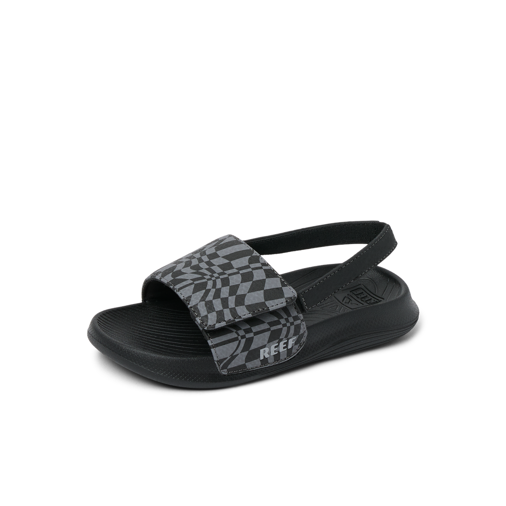 Little Salty Slide sandal for boys facing right, close-up on cushioned sole and checkered strap with arch support.