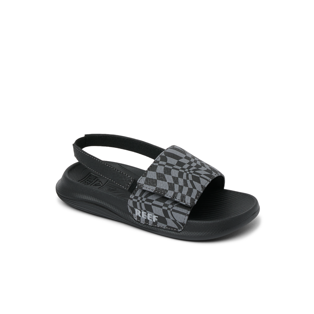 Little Salty Slide for boys facing right, water-friendly comfort sandal with checker pattern and soft cushioning.