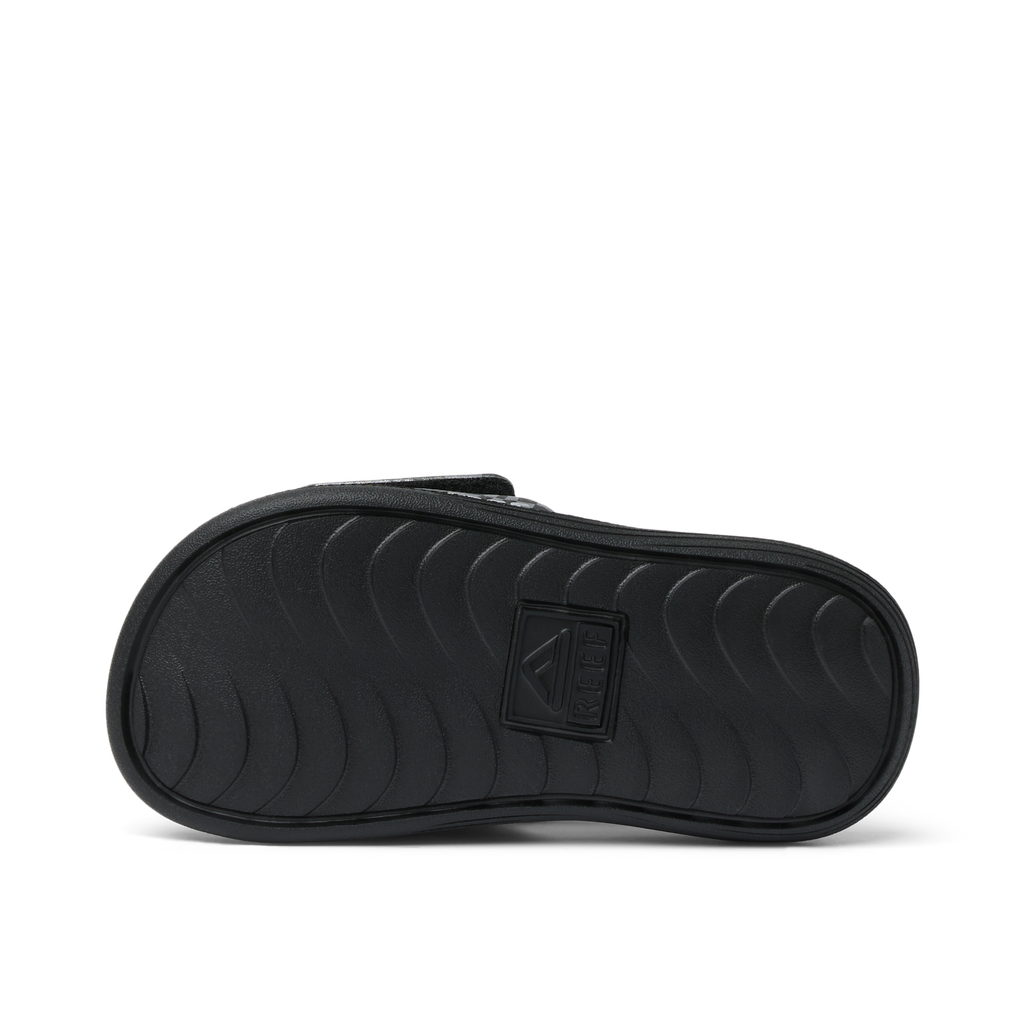 Little Salty Slide for boys aged 2-4 showing the sole facing up, with durable, water-friendly comfort features.