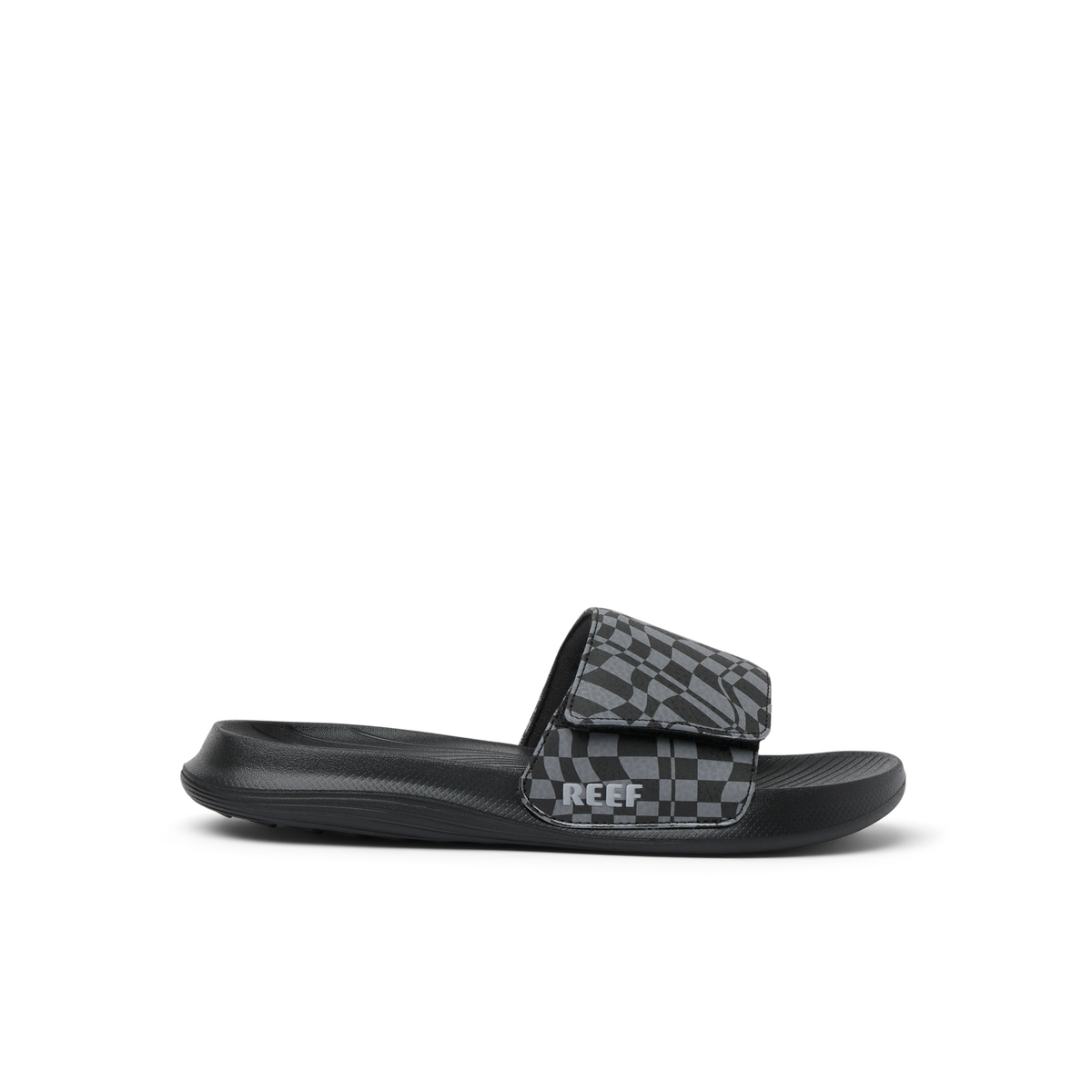 Kids Salty Slide facing left, black with checker pattern, featuring anatomical arch support and soft cushioning for comfort.