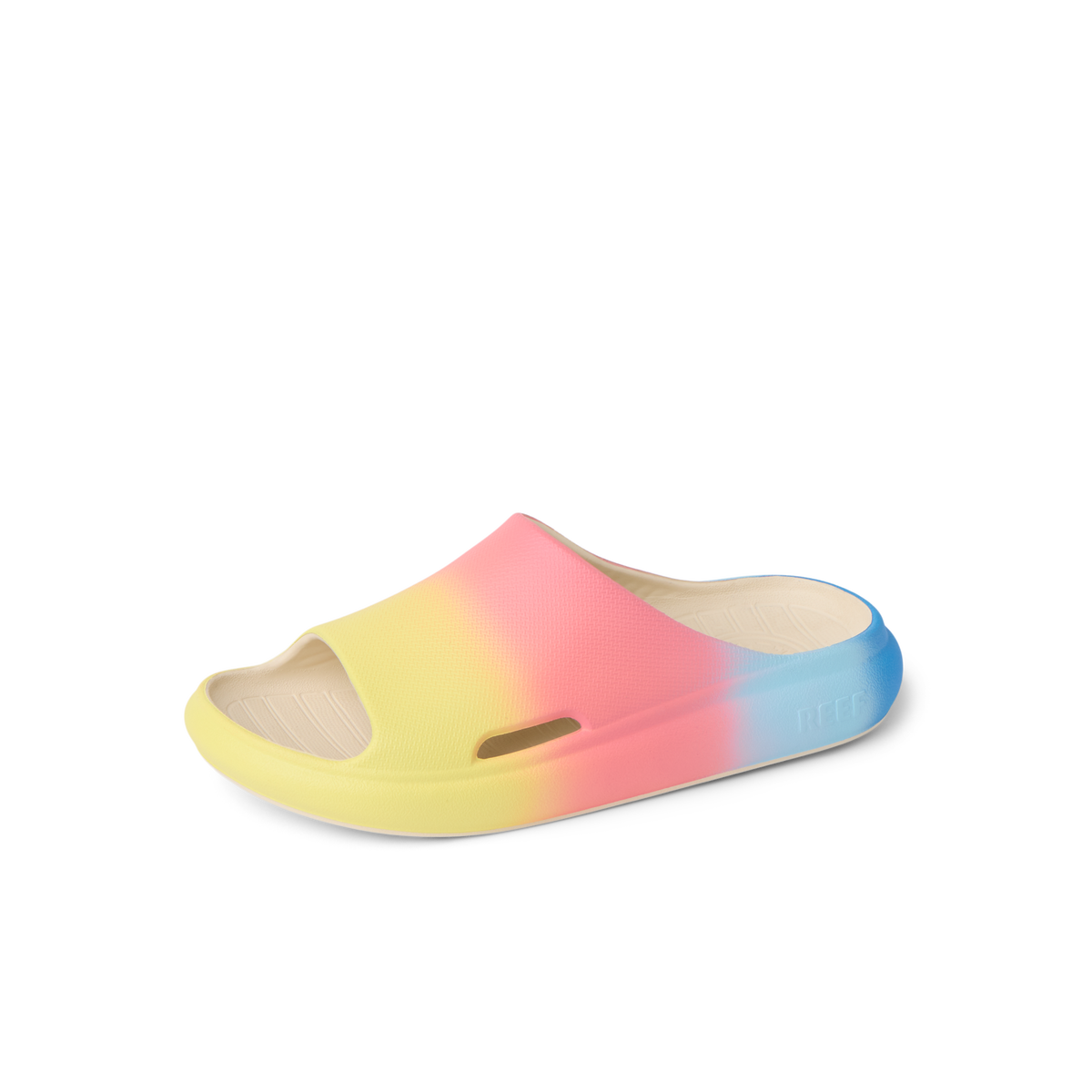 Kids Rio Slide sandal facing left with blue, pink, and yellow ombre colors, water-friendly and comfort-focused design.