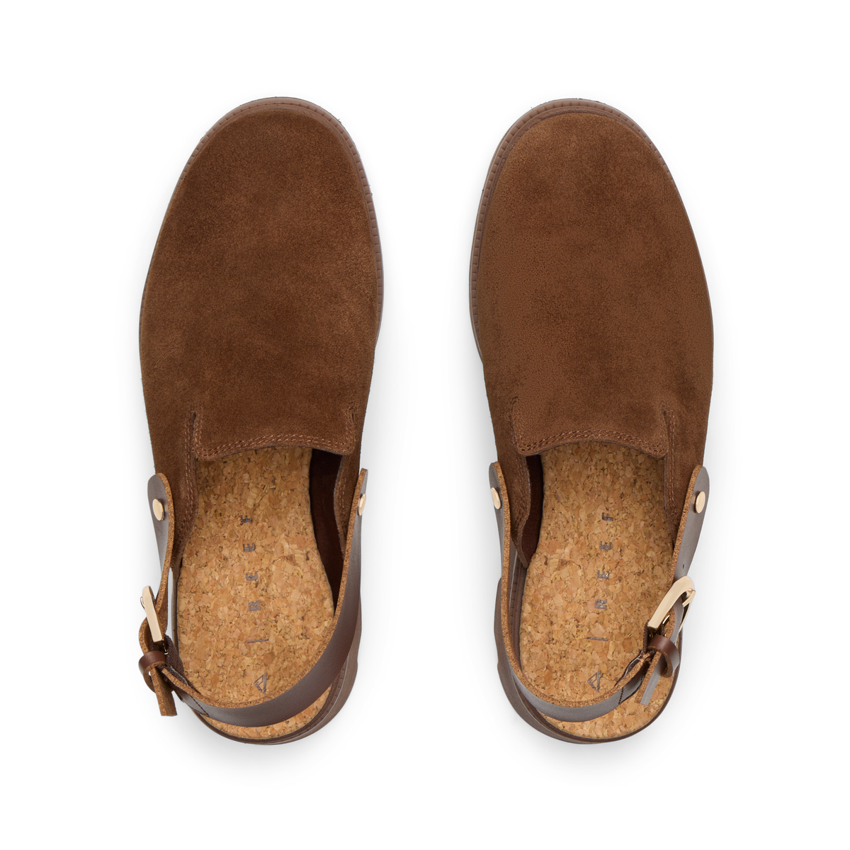 Top-down view of brown suede Vista Luxe Solene clogs facing upward, featuring adjustable buckle straps and cushioned footbeds.