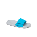 Kids Salty Slide sandal facing right with grey sole and bright blue adjustable strap, featuring comfort and arch support.
