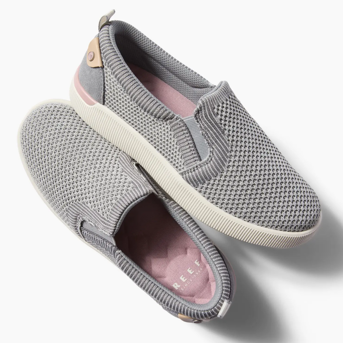 Pair of grey Neptune Elyse slip-on shoes for women, lightweight with cushioning and anatomical arch support, right shoe facing left.