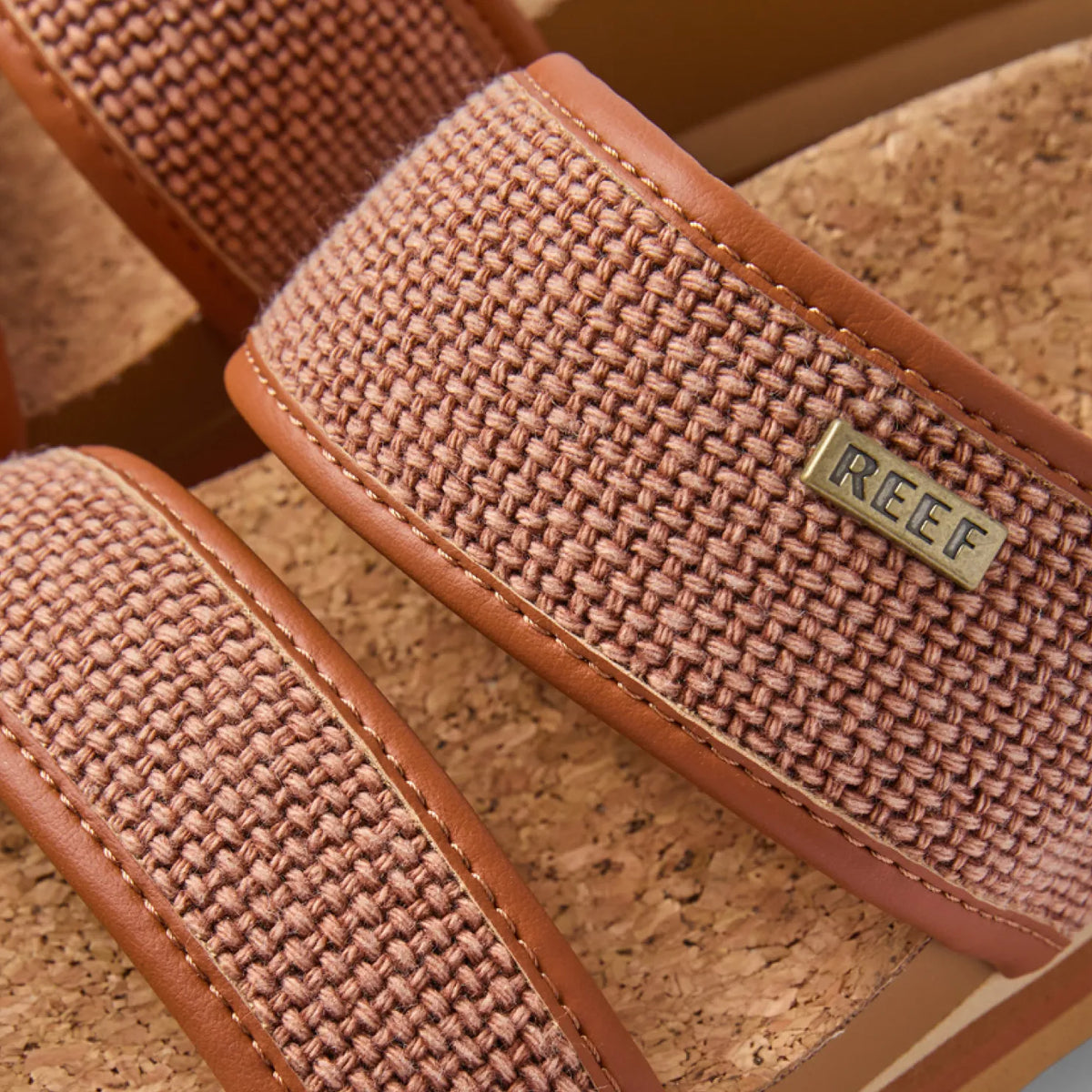 Close-up of the top straps facing upward on Cushion Vista Higher sandals with woven fabric and anatomical arch support.